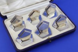 A cased set of six stylish George V silver menu holders by Asprey & Co Ltd, of pentagonal form,