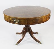 A 19th century mahogany circular drum table, with parquetry inlaid top, fitted with four frieze