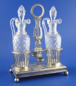An early 19th century French neo-classical 950 standard silver liqueur decanter stand with two cut