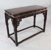 A 20th century Chinese carved rosewood side table, the top with inset rectangular burr wood panel,