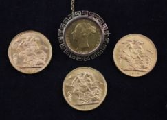 Three George V gold full sovereigns, 1913, 1922 & 1923 and an 1864 half sovereign, mounted as a