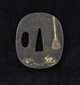 A Japanese shakudo work tsuba, Meiji period, of oblong form, relief decorated with rats being