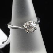 A platinum set solitaire diamond ring, the round cut diamond weighing approximately 0.95-1.00ct,