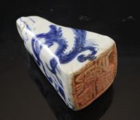 A Chinese blue and white porcelain seal, probably 19th century, painted with a stylised dragon