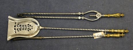 A set of three 19th century brass and steel fire irons, with acanthus leaf cast handles includes,