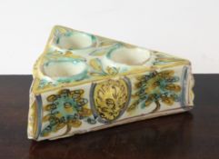 A Talavera Spanish polychrome maiolica triangular inkwell, 18th century, each side moulded with a