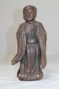 A Chinese lacquered wood figure, 17th / 18th century, probably one of the He He Erxian twins,