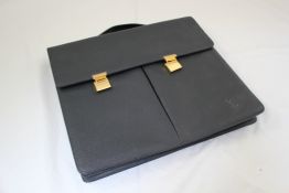 A black leather Louis Vuitton brief case, 16in.