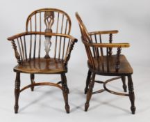 A matched set of eight 19th century yew wood and elm Windsor armchairs, with pierced central
