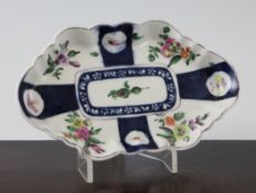 A Worcester polychrome spoon tray, c.1770, of lobed ovular form, decorated with segmented panels of