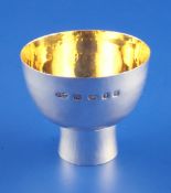 A modern silver pedestal cup by Myrtle Bromley Skelton, of plain circular form, with hollow