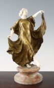 An Art Deco bronze and ivory figure of a dancing maiden, signed A. Very, the figure wearing long