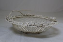 A Belleek `Sydenham Twig` basket, Second Period, c.1893-1926, modelled around a three strand base,