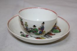 A Worcester polychrome tea bowl and saucer, c.1765, painted with a Chinese family around a table,