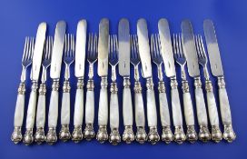 Nine pairs of Victorian mother of pearl handled silver dessert eaters, with engraved armorial and