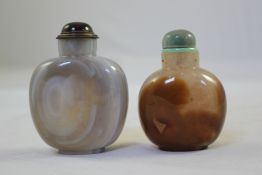 Two Chinese large agate snuff bottles, 20th century, 7cm. & 7.8cm.
