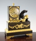 A 19th century French Empire style bronze and ormolu mantel clock, surmounted with a hound and