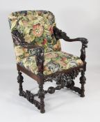 A 19th century carved Italian open armchair, in the manner of Andrea Brustolon, with needlepoint