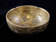 A Japanese Satsuma pottery bowl, Meiji period, by Hododa, painted with reserves of figures in