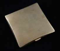An engine turned 9ct gold cigarette case, of square form, with interior inscription, gross weight