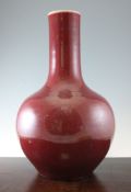 A large Chinese sang de boeuf glazed bottle vase, unglazed base, 60cm.