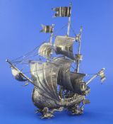 An early 20th century Hanau silver Nef, modelled as a three masted ship with figures, the hull with