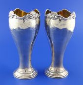A pair of George V silver vases by Goldsmiths & Silversmiths Co Ltd, of circular tapering form,