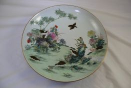 A Chinese famille rose `six quail` dish, Guangxu mark but later, painted with quail amid rock work,