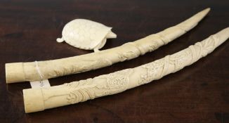 A pair of African ivory tusks carved with snakes, lions, birds and palm trees, 20in and an ivory