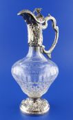 A late 1970`s silver mounted glass claret jug, of baluster form, with fruiting vine decoration and