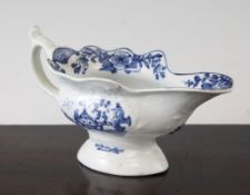 A Worcester `Triangular Platform` pattern sauceboat, c.1760, the shaped body painted in blue, with