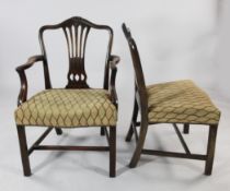 A set of eight Hepplewhite style mahogany dining chairs, with arched backs, pierced splats and