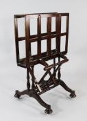 A Victorian mahogany folio stand, with tapering turned supports and downswept base, W.2ft 6in.