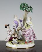 A Meissen group of a dancing couple, late 19th century, after the model by Kaendler, with a