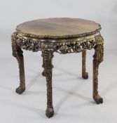 A 19th century Chinese rosewood circular centre table, the lobed top above a floral leaf and fruit