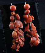 A pair of white metal and carved coral "leaf and berry" drop earrings, 2.75in.