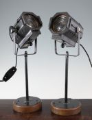 A pair of 1940`s metal stage footlights by Times Square Studio Supply Corp, on later stands, with