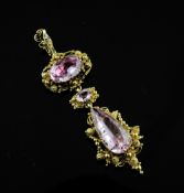 A continental gold and pink topaz drop pendant, set with oval and teardrop shaped topaz in a