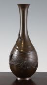 A Japanese bronze bottle vase, Meiji period, cast in relief with fish in shallow water and fishing