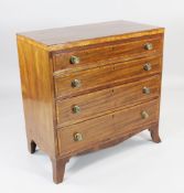 A George III mahogany and satinwood banded chest, of four long graduated drawers, with brass