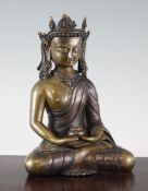 A Sino-Tibetan bronze figure of a Buddha, seated in dhyansana, and holding a bowl in both hands,