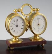 An Edwardian ormolu combined desk timepiece / barometer, with oval dials and rouge marble base, 6.