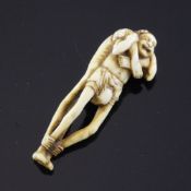 A Japanese ivory netsuke of Ashinaga and Tenaga, 19th century, the two figures with legs locked