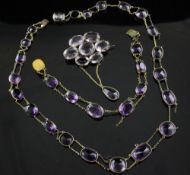 A late Victorian gold and amethyst necklace and matching bracelet, set with graduated stones (a.f.),