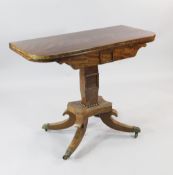 A 19th century mahogany folding card table, with tapered column, platform base and four downswept
