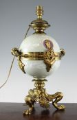 A Victorian porcelain and ormolu mounted oil lamp, now converted for electricity, the green ground