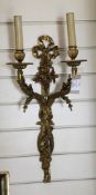 A pair of ormolu two branch wall lights, decorated with entwined ribbon, scrolls and grape vines,