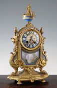 A 19th century French gilt metal and Sevres style porcelain mantel clock, decorated with butterflies
