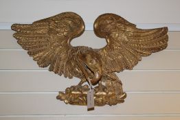 A Victorian carved giltwood wall appliqué, modelled as an eagle, 29in.