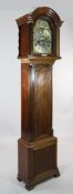 An early 20th century mahogany eight day longcase clock, the 12 inch arched brass dial with silvered